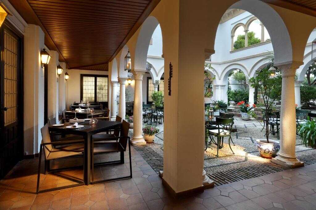 Covered terrace beside the hotel courtyard